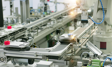 Robot picking up product on a manufacturing line