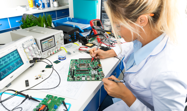 electronic engineer testing computer motherboard