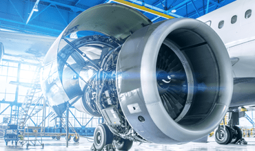 airplane being repaired in aircraft hangar