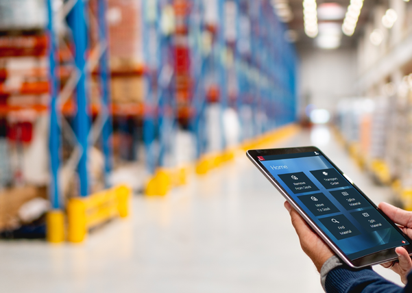 man in warehouse with ipad