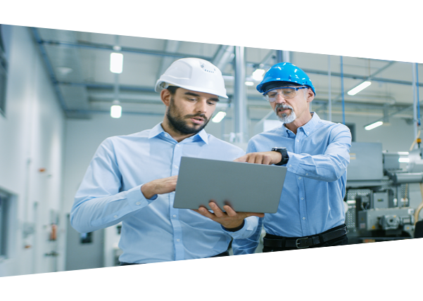 Head of the project holds laptop and discusses work details with customer in factory