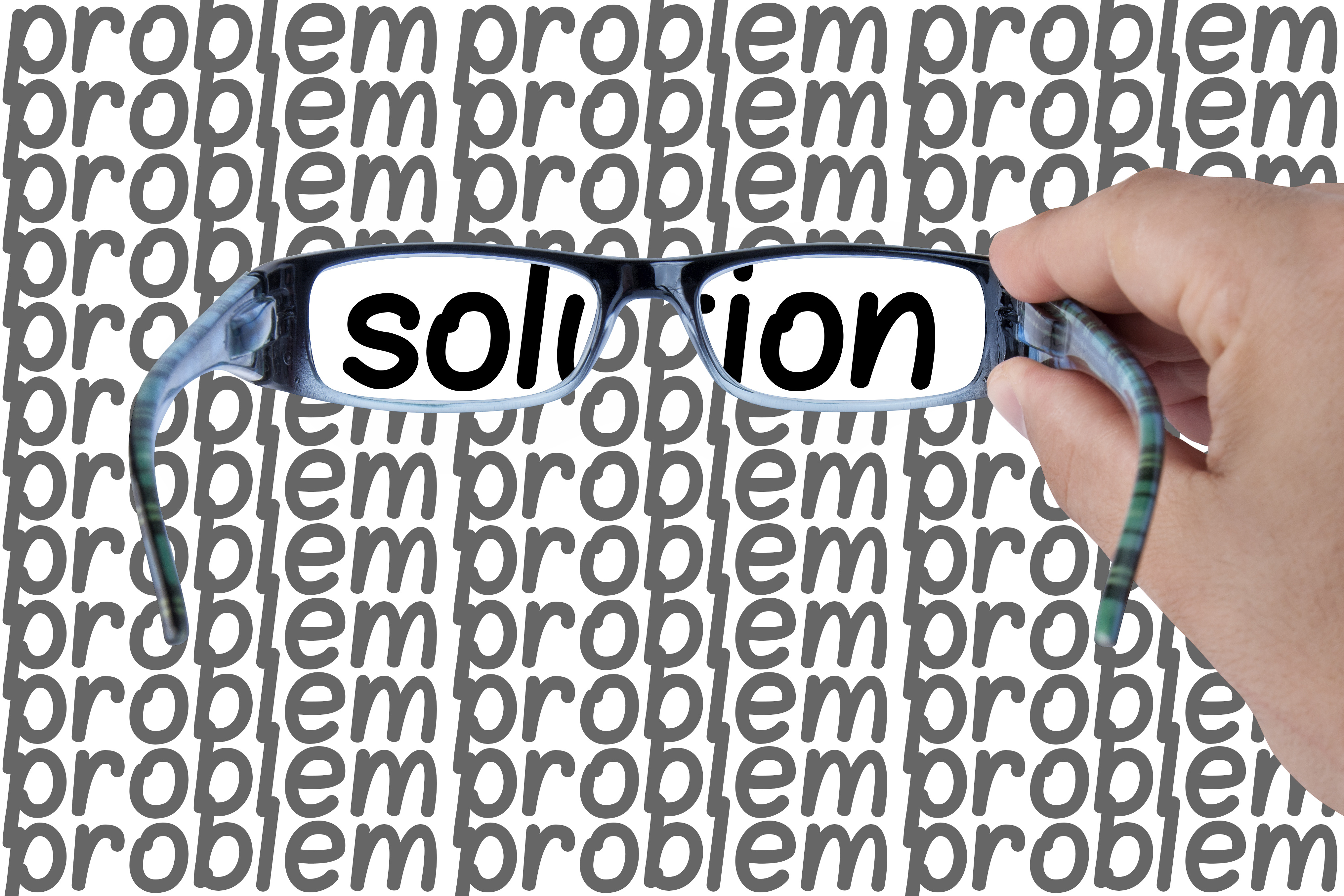 hand solding glasses over the words problem