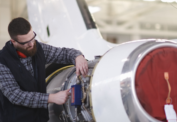 person working on airplane