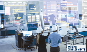 Workers standing in front of digital screens